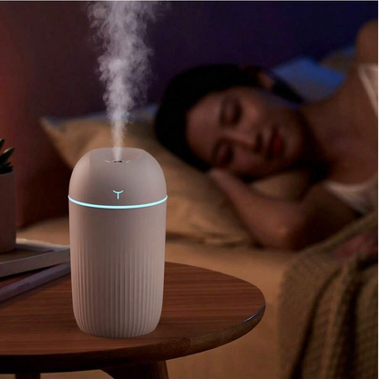 Stilren och liten snygg luftfuktare med mikro USB laddning vit med LED-färger för ånga och fukt i hem eller bil